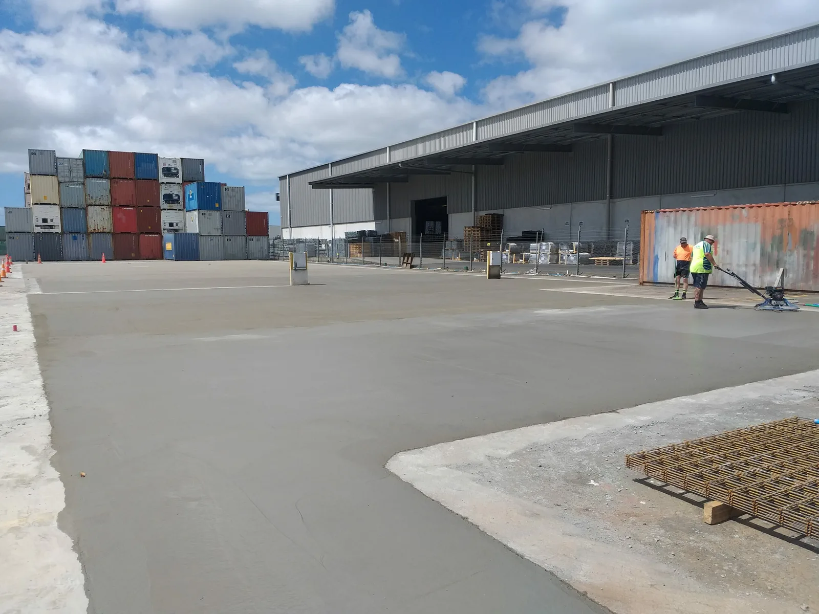 Large poured concrete hardstand at a commercial container yard