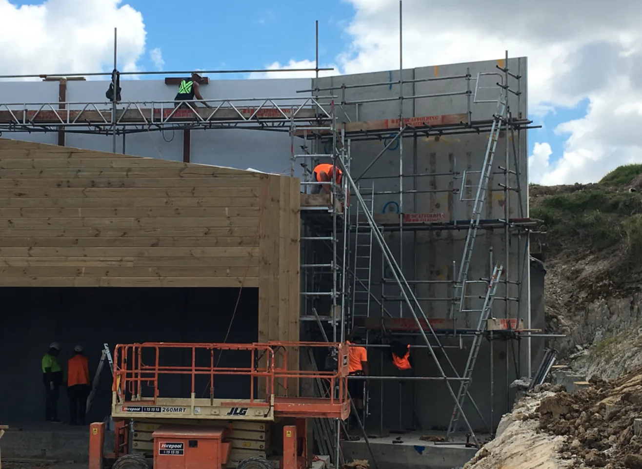 Scaffolding erected around a commercial building under construction