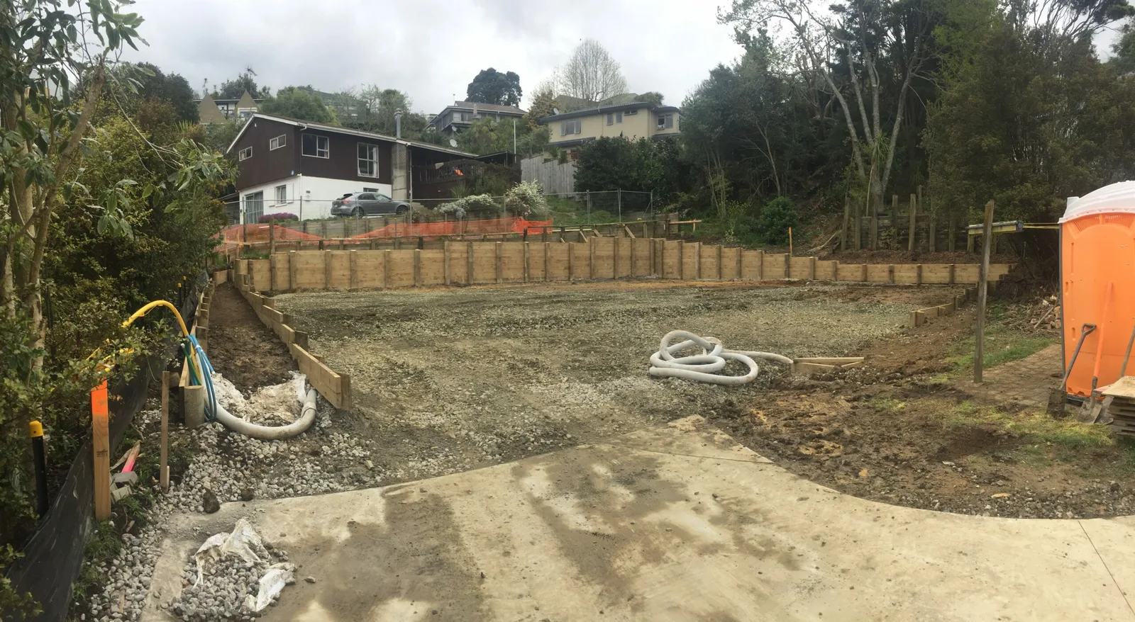 Excavated and levelled building platform with retaining boxing in place
