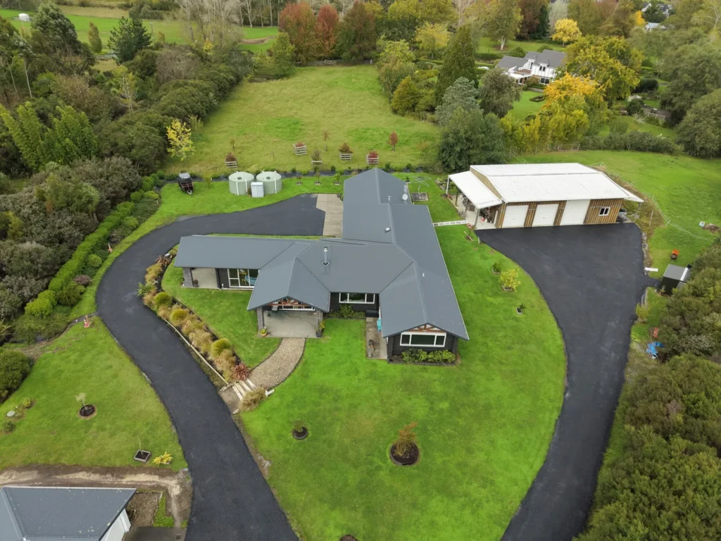 Aerial view of a rural property with a sealed circular driveway